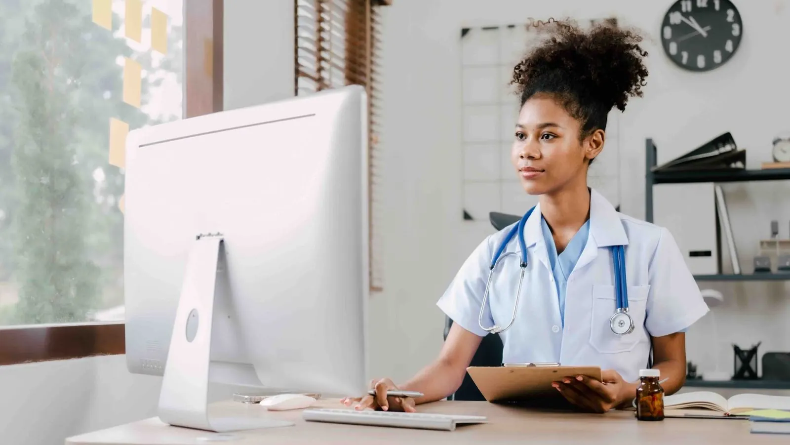 Doctor at computer desk