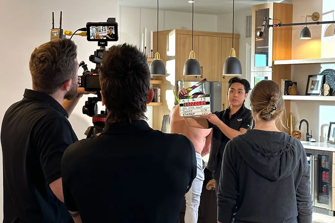 Crew on set with clapperboard