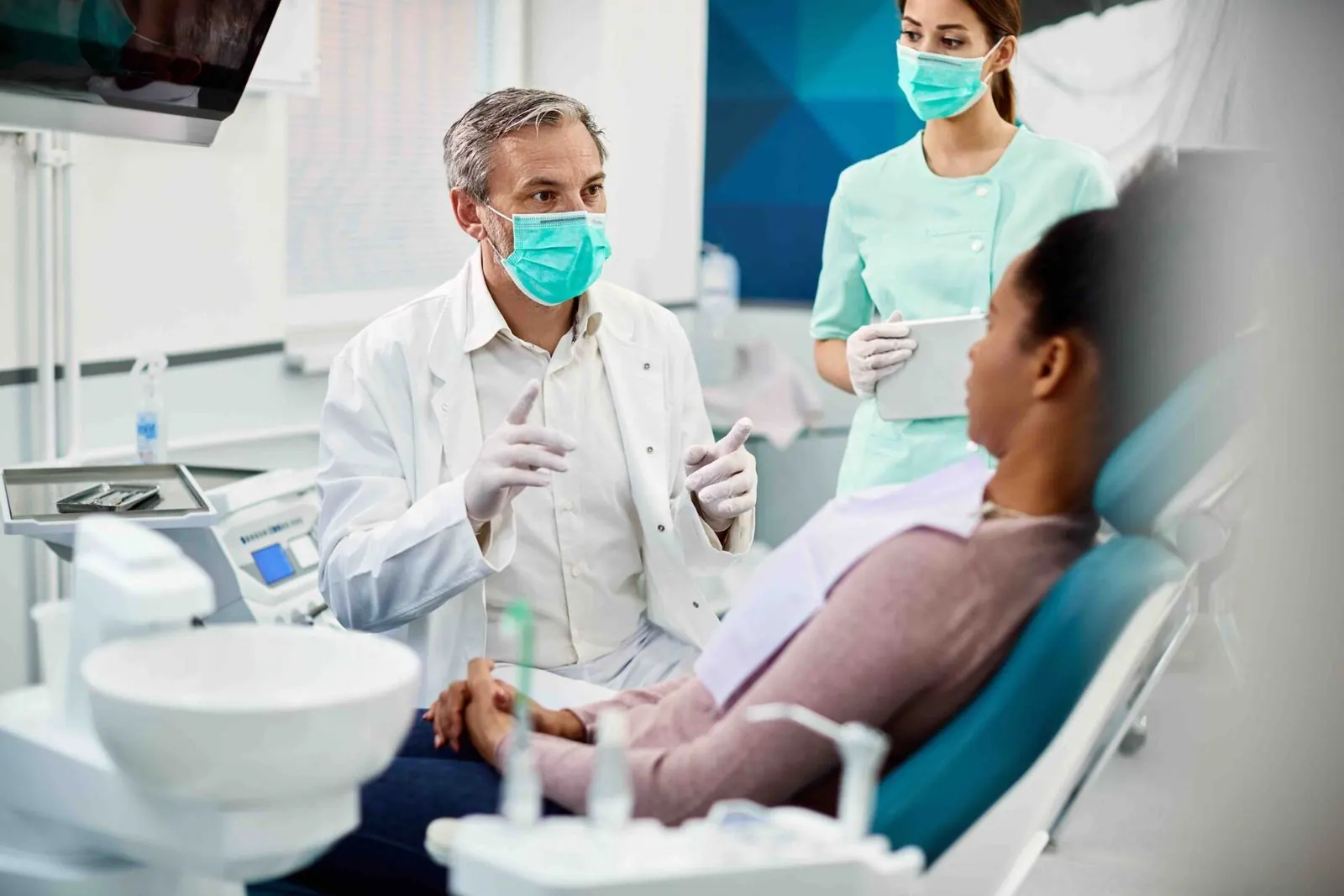 Dentist treating patient